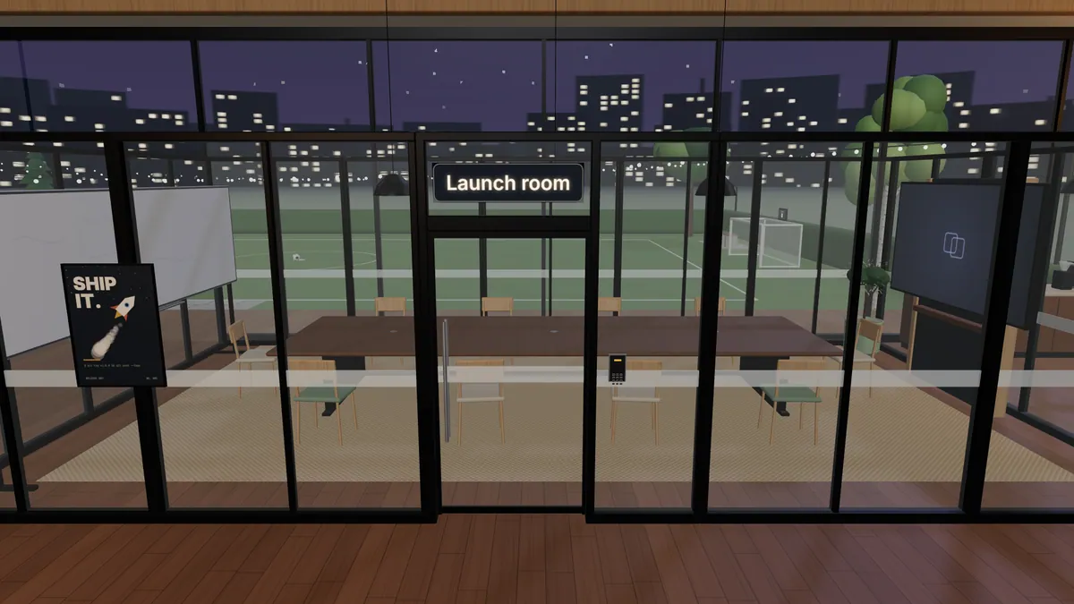 A glass meeting room in the studio at night, with its door and keypad.